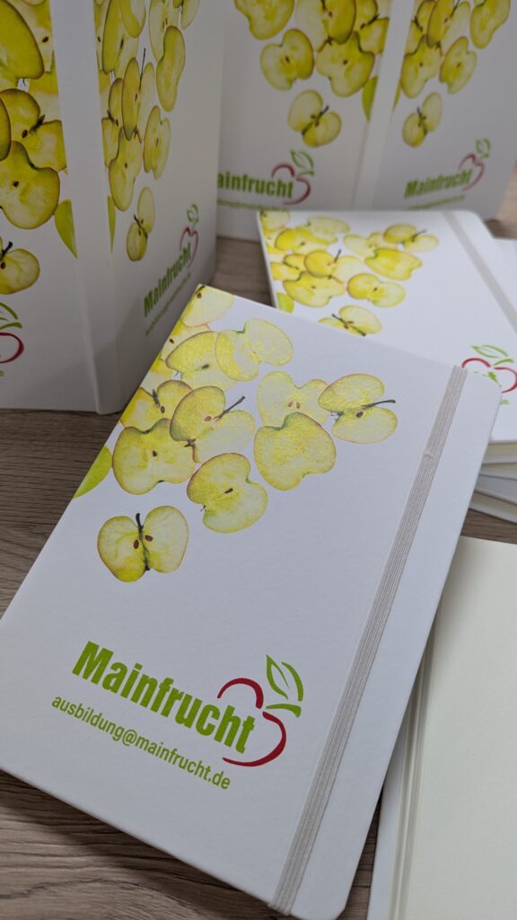 weißes personalisiertes Notizbuch für die Firma Mainfrucht